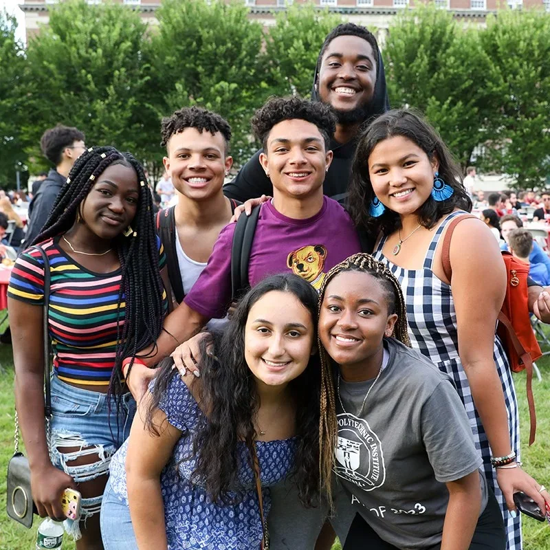 Group of smiling students outside