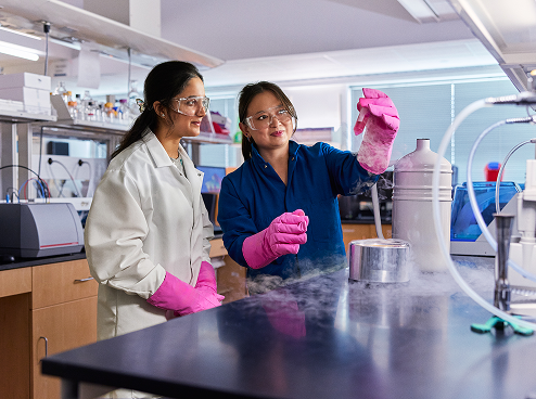 Professor Helen Zha and her student observing a specimen in the lab