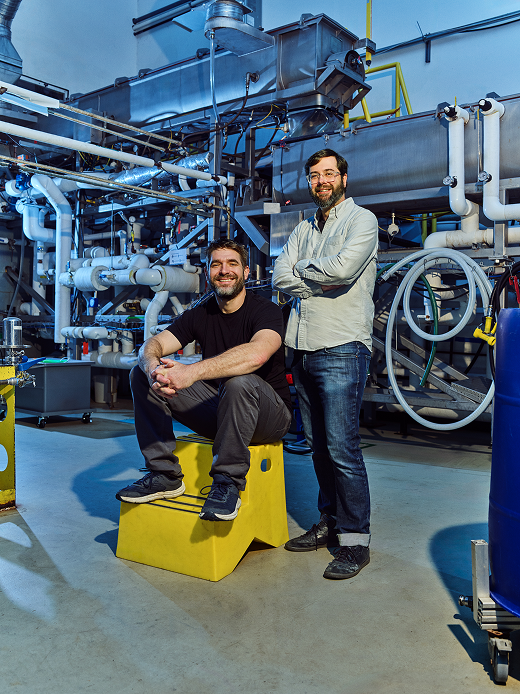 A portrait of Eben Bayer and Gavin McIntyre in the Ecovative facility 