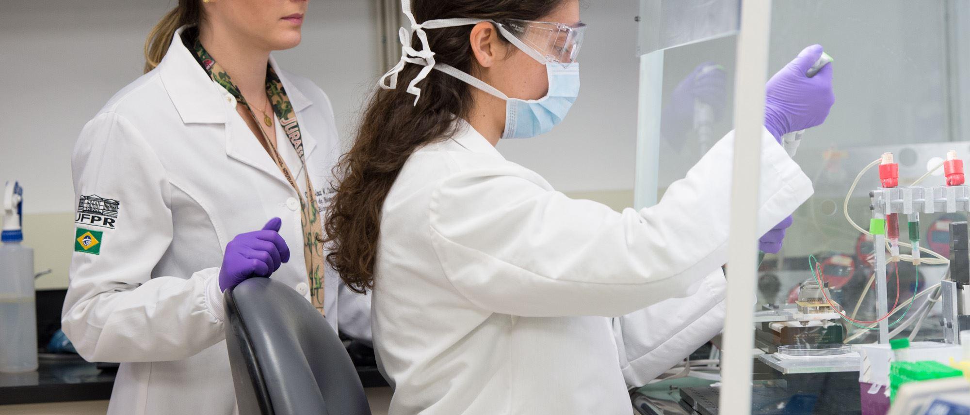 Two people in a lab environment