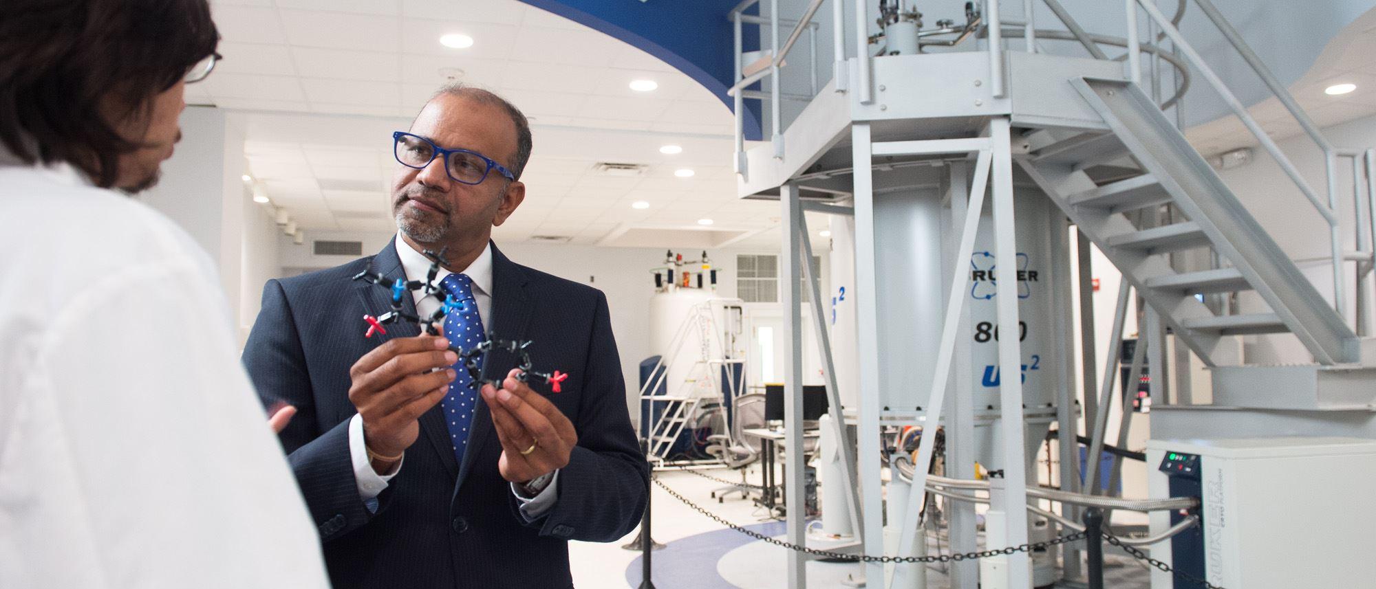 Deepak Vashishth, Ph.D. in front of Bruker 800 (18.8 Tesla) 4 channel AVII NMR spectrometer